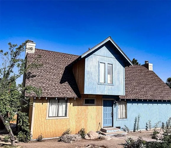 Exterior of a house before Tri Peak Construction & Design, Inc. remodeled it.