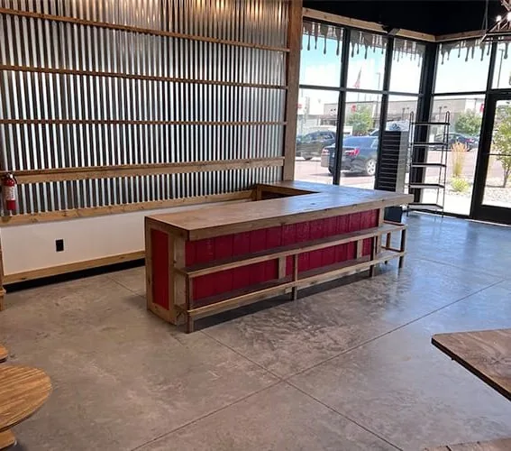 Storefront interior finished with corrugated metal, cedar slats, and a custom wood counter.
